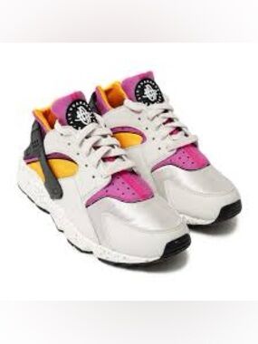 Nike Air Huarache Run sneakers in the "Light Bone" and "Lethal Pink"